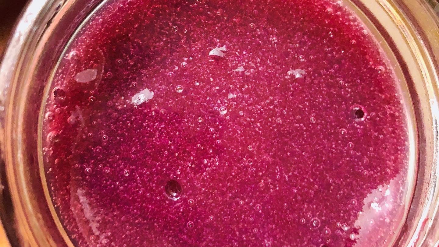 Close-up of a jar containing a purple substance