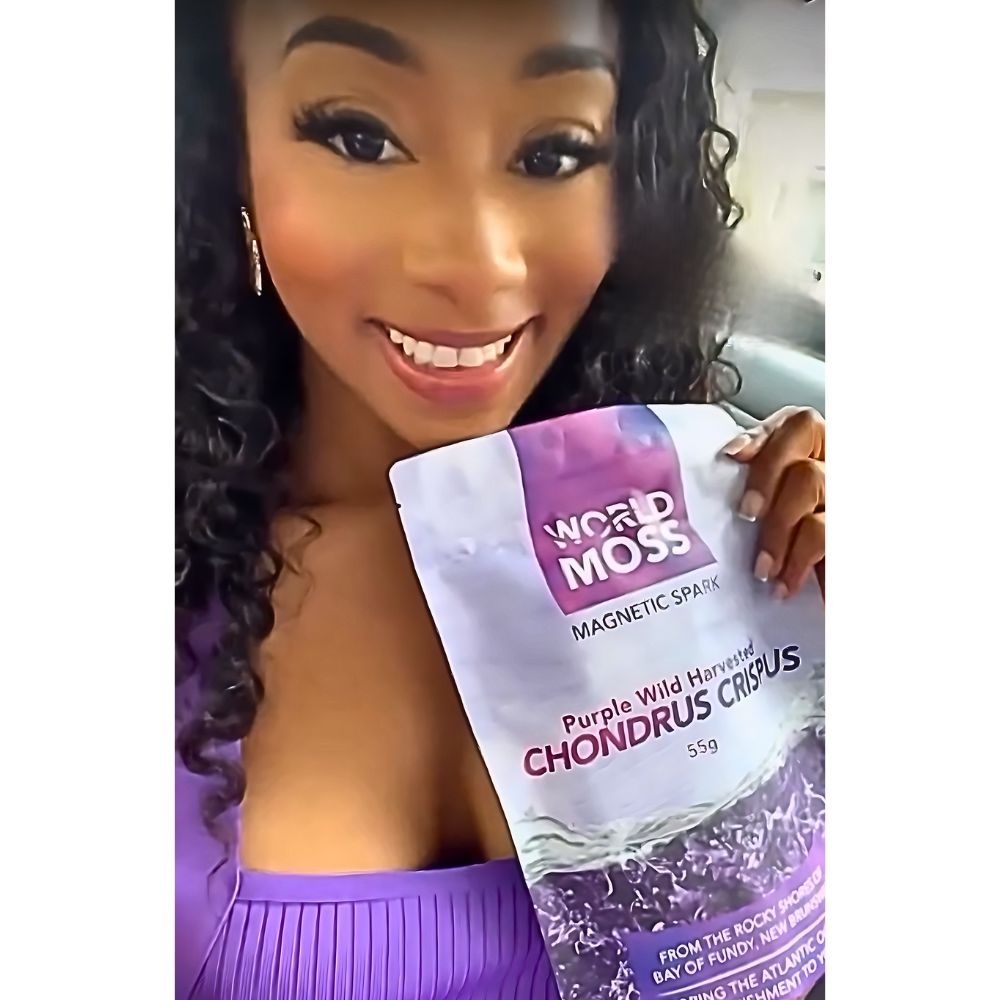 woman holding magnetic spark from world moss purple irish moss gel