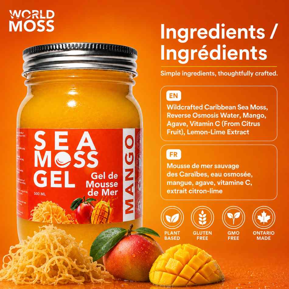A jar of World Moss Sea Moss Gel in Mango flavor, displayed on an orange background with ingredient text and illustrations of mangoes and seaweed. The jar has a red label with white and yellow text, a silver metal lid, and is surrounded by loose seaweed strands and fresh mangoes.