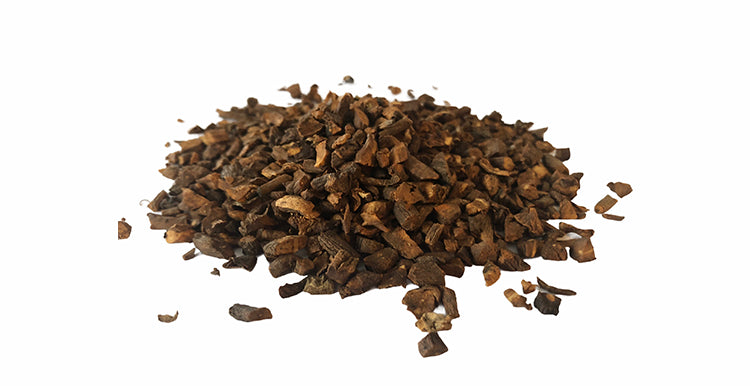 Organic dandelion root pieces in a pile for herbal remedies and natural wellness
